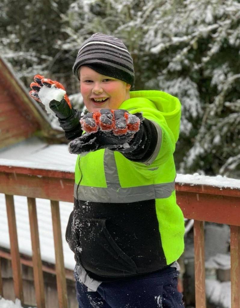 Grandson/nephew Jonah Hurst practices tossing snowballs in Wrangell. (Courtesy Photo / Nikka Mork)