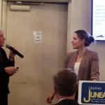 McKinley Research Group President Susan Bell, left, and CBJ Tourism Manager Alexandra Pierce discuss the results of an annual survey of residents about tourism during the Juneau Chamber of Commerces weekly luncheon Thursday at the Juneau Moose Family Center. (Mark Sabbatini / Juneau Empire)