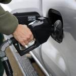 Juneau resident Luke Taintor fills up his truck at the Petro One gas station off Egan Drive. (Clarise Larson / Juneau Empire)