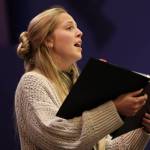 Soloist Christine Wick sings during rehearsal for Juneau Symphonys Holiday Cheer concert. (Ben Hohenstatt / Juneau Empire)