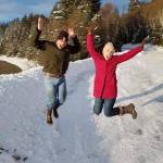 Theresa Hicks and friend Patrick Chamberlin have a celebratory jump after harvesting a tree from the Tongass National Forest. (Courtesy Photo / Theresa Hicks)