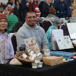 Corinne and Lyle James celebrate their new business venture, Tlingit Aesthetics, selling stickers, prints, cards and apparel at the annual Stocking Stuffer Showcase on Saturday, Dec. 10. (Jonson Kuhn / Juneau Empire)