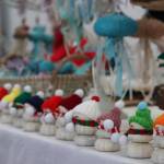Margaret Mimnaugh with Tidal Creations from Ketchikan sets up her seasonal creations made with found hand painted sea urchin shells, along with snowmen and jelly fish at this years Stocking Stuffer Showcase on Saturday the Juneau Arts and Culture Center. (Jonson Kuhn / Juneau Empire)