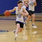 Samuel Lockhart  dribbles down the court while looking for a teammate cutting toward the hoop during a drill at Thunder Mountain High School. The 2022-23 iteration of the  TMHS boys basketball returns last year's leading scorers.