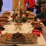 A long table offers nearly 20 cookie and fudge varieties to visitors at the governors annual holiday open house Tuesday. (Mark Sabbatini / Juneau Empire)