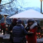 Greeters pass out cookies to people waiting outside during the governors annual holiday open house on Tuesday. (Mark Sabbatini / Juneau Empire)