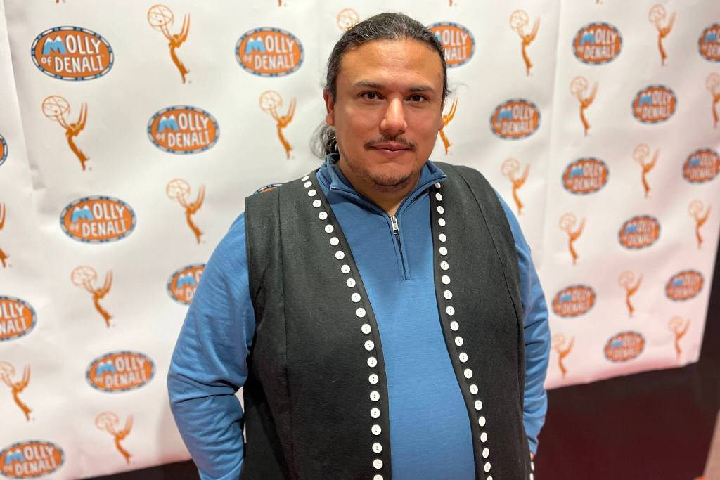 Tlingit playwright and teacher Frank Henry Kaash Katasse poses for a photo on Tuesday during a welcoming home ceremony at Dzantiki Heeni Middle School. Katasse just returned from attending the Emmy Awards where the show he writes for Molly of Denali was nominated for two awards. (Jonson Kuhn / Juneau Empire)