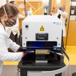 Karen Spaleta UAF loading a segment of mammoth tusk for analysis at the Alaska Stable Isotope Facility. (Courtesy Photo / Matthew Wooller)