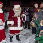 Mr. and Mrs. Claus stop to visit families at Cedar Park during the annual Capital City Fire/Rescue Santa Parade in December 2018. (Michael Penn / Juneau Empire File)