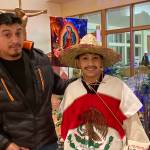 Imanol Vera (right) smiles for a photo after staring as Juan Diego in the Sunday evening play a part of a celebration of the Feast Day of Our Lady of Guadalupe at St. Paul Catholic Church. (Courtesy / Delores Gonzalez)