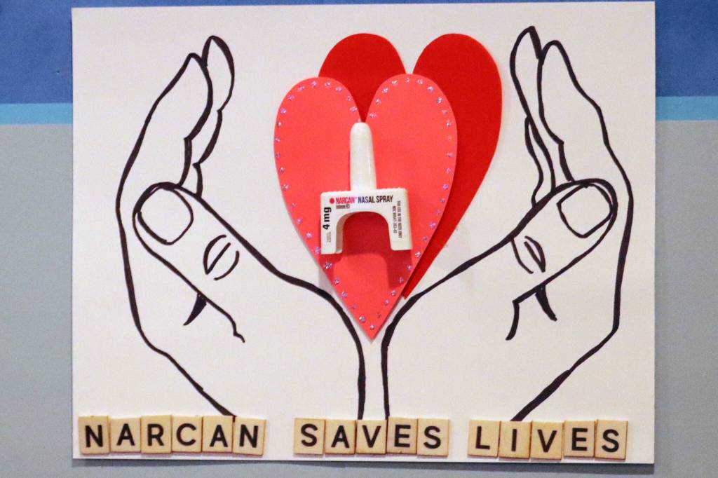 This November 2021 photo shows a poster promoting Narcan, a drug that can reverse opioid overdoses, inside the Juneau Public Health Center. According to statistics shared recently by the state, overdose deaths have been on the rise recently. (Ben Hohenstatt / Juneau Empire File)