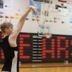 JDHS junior Jonathan Sleppy practices 3-point shots early on Wednesday before practice. (Jonson Kuhn / Juneau Empire)