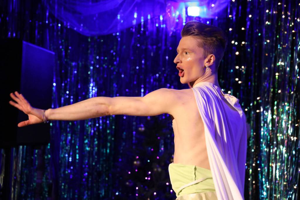 Performer Alvi lip-syncs on the Alaskan Bar stage during the first show of the Juneau Drags Holi-gay Spectacular Ho Ho HOMO Saturday evening. (Clarise Larson / Juneau Empire)