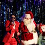 Luke the Duke of Bell and Santa bust a move during their performance Saturday evening at the Alaskan Bar, a part of Juneau Drags Holi-gay Spectacular Ho Ho HOMO. (Clarise Larson / Juneau Empire)