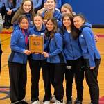 The Thunder Mountain High School girls basketball team poses for a photo with a plaque after winning the Sitka Coastal Holiday Classic tournament. (Courtesy Photo)