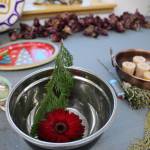 Items sit at the community altar at a celebration of the winter solstice on Wednesday afternoon at Generations Southeast. (Clarise Larson / Juneau Empire)