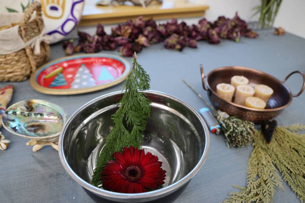 Items sit at the community altar at a celebration of the winter solstice on Wednesday afternoon at Generations Southeast. (Clarise Larson / Juneau Empire)