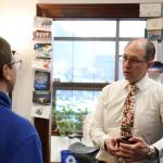 Clarise Larson / Juneau Empire 
State Sen. Jesse Kiehl chats with a student at his office in the Alaska State Capitol during the Juneau legislative delegations holiday open house Thursday afternoon.
