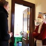 State Rep. Andi Story chats with Tawnya Kreft at her office in the Alaska State Capitol during the Juneau legislative delegations holiday open house Thursday afternoon. (Clarise Larson / Juneau Empire)