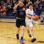 Ben Hohenstatt / Juneau Empire 
Samuel Lockhart makes his way toward the hoop for a tough layup following a TMHS steal. Lockhart, a junior, finished the game with 10 points.
