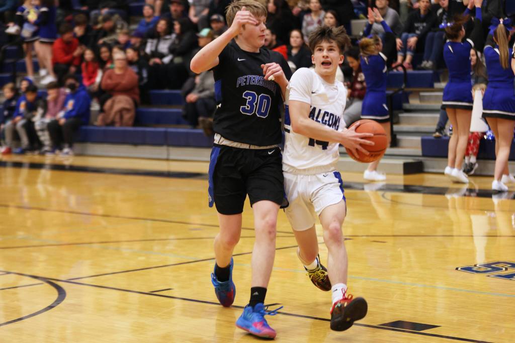Ben Hohenstatt / Juneau Empire 
Samuel Lockhart makes his way toward the hoop for a tough layup following a TMHS steal. Lockhart, a junior, finished the game with 10 points.