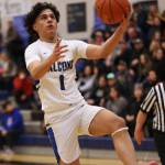 Ben Hohenstatt / Juneau Empire 
Krishna Sanguni goes up for a layup during the fourth quarter a TMHS Falcons win against Pertersburg. The junior was one of 11 players to score during the game, including a putback in the closing seconds of the first half.
