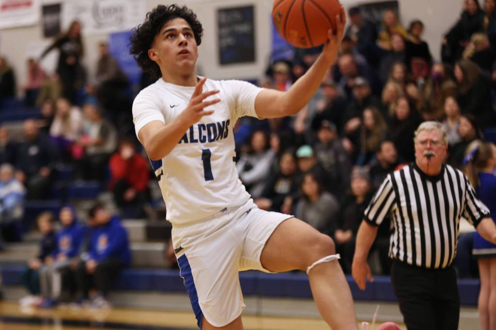 Ben Hohenstatt / Juneau Empire 
Krishna Sanguni goes up for a layup during the fourth quarter a TMHS Falcons win against Pertersburg. The junior was one of 11 players to score during the game, including a putback in the closing seconds of the first half.