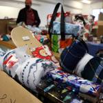 Gifts donated to St. Vincent de Paul for its annual Adopt-A-Family holiday program await pickup by Juneau residents on Thursday at the facilitys Teal Street complex. The organization, which got more than 300 requests for gifts from families, initially had to stop accepting them earlier this week due to demand exceeding donations. But during the past two days an infusion of gifts and donations have been made to the campaign, according to St. Vincents Executive Director Dave Ringle. (Clarise Larson / Juneau Empire)