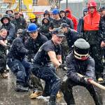 Team Elm faces off against Team Cypress in a tug of war battle in heavy rain during the U.S. Coast Guards annual Buoy Tender Olympics on Aug. 17 at the Coast Guard Station Juneau. (Jonson Kuhn / Juneau Empire)
