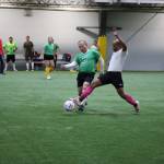 Clarise Larson / Juneau Empire
Jamaal Bailey extends his leg in a effort to keep the ball away from opposing player Doug Badilla during a soccer match Monday evening at the Dimond Park Field House a part of the Holiday Cup soccer tournament.