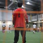Nathan Schroeder protects the net for his team, the Chilkat Bandits Monday evening at the Dimond Park Field House a part of the Holiday Cup soccer tournament. (Clarise Larson / Juneau Empire)