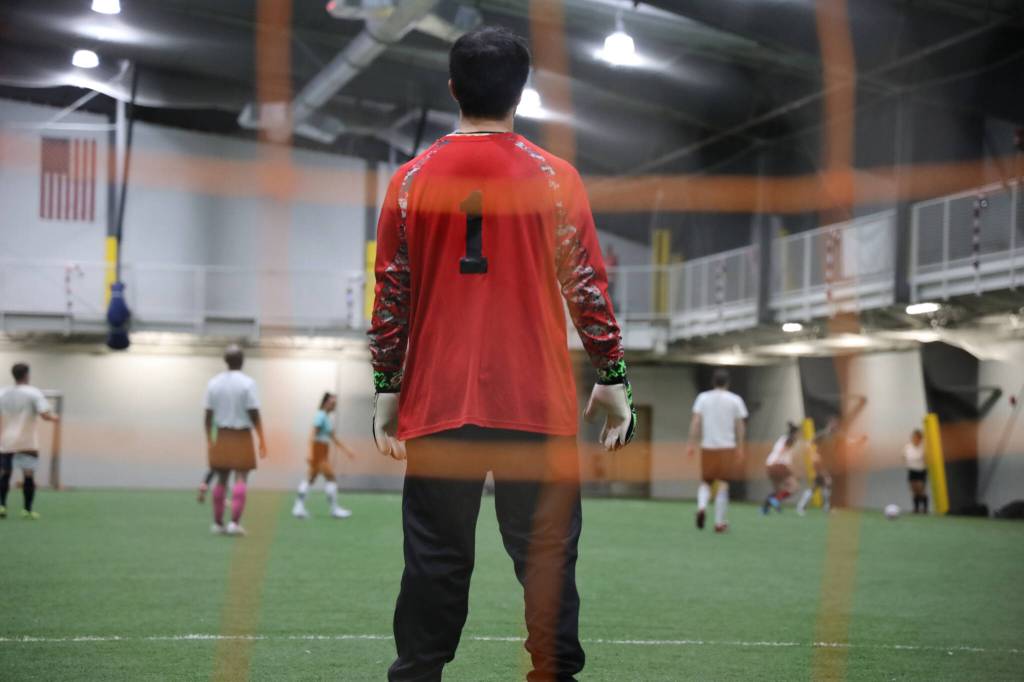 Nathan Schroeder protects the net for his team, the Chilkat Bandits Monday evening at the Dimond Park Field House a part of the Holiday Cup soccer tournament. (Clarise Larson / Juneau Empire)