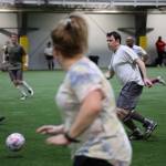 Ann Hoke await a pass from her teammate, Mickey Kenny, during a soccer match Monday evening at the Dimond Park Field House a part of the Holiday Cup soccer tournament. (Clarise Larson / Juneau Empire)