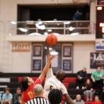 Players from West Valley High School and Anchorage Christian School reach for a basketball flying in the air Wednesday afternoon at Juneau-Douglas High School: Yadaa.at, marking the start of the annual Princess Cruises Capital City Classic. (Clarise Larson / Juneau Empire)