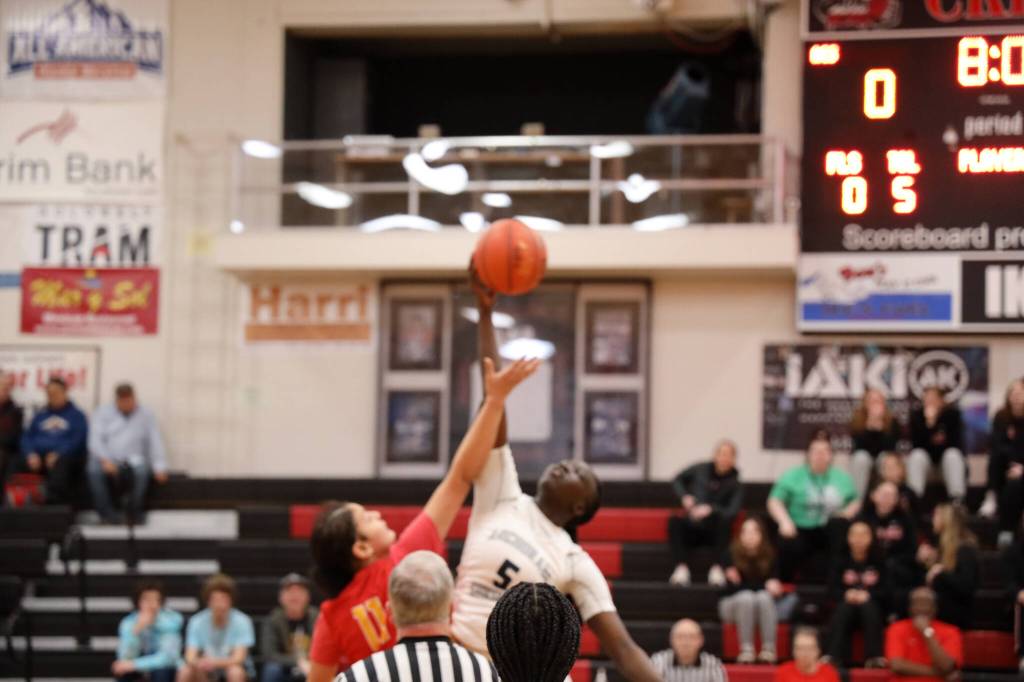 Players from West Valley High School and Anchorage Christian School reach for a basketball flying in the air Wednesday afternoon at Juneau-Douglas High School: Yadaa.at, marking the start of the annual Princess Cruises Capital City Classic. (Clarise Larson / Juneau Empire)