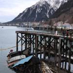 Clarise Larson / Juneau Empire 
The privately owned 107-foot tugboat named Tagish sits partially below the water next to the National Guard dock south of the downtown cruise ship docks Thursday morning. Officials were at the at the scene to assist cleanup mitigation and recovery efforts.