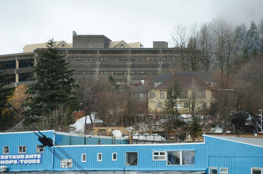 Juneaus Telephone Hill neighborhood is seen at center right, beneath the State Office Building, on Wednesday, Dec. 28, 2022. The neighborhood, owned by the state of Alaska, is being transferred to the City and Borough of Juneau. (James Brooks / Alaska Beacon)