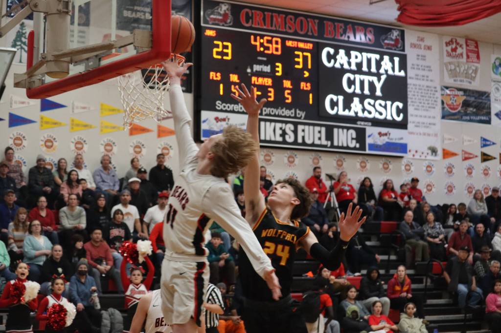 JDHS junior guard Sean Oliver scores a layup against West Valley High School on Friday during the conclusion of the Princess Cruises Capital City Classic tournament. The Crimson Bears girls team also played against Anchorage Christian School. (Jonson Kuhn / Juneau Empire)