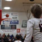 JDHS junior guard Sean Oliver watches as he sinks a 3-point shot during Fridays game against West Valley High School for the closing game of the Capital City Classic tournament. Oliver led the Crimson Bears Boys team with a total of 12 points. (Jonson Kuhn / Juneau Empire)