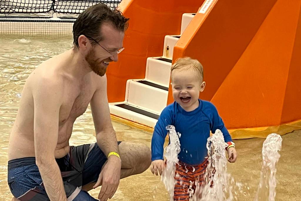 James Snookes plays with his son Harry in the pool at the Dimond Park Aquatic Center as part of the SAFE Child Advocacy Centers free sponsored event Family Day at the Pool. (Jonson Kuhn / Juneau Empire)