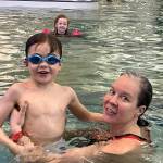 Barrow and Lupin West cheer on their mom Olivia Barrow while she swims laps at Family Day at the Park on Saturday. (Jonson Kuhn / Juneau Empire)