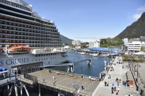 Cruise passengers walk near the docks in Juneau during the 2022 cruise ship season. Tourism-related industries and transportation had the highest rates of growth in Southeast Alaska last year as the region added 2,400 jobs instead of the 1,400 forecast in 2022, according to this month’s Alaska Economic Trends report. Seafood processing jobs saw the largest decline at 20%. (Peter Segall / Juneau Empire)