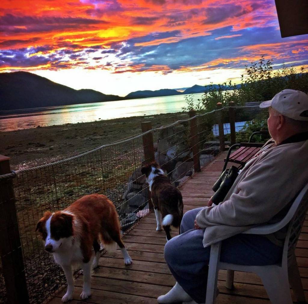 Mickey Prescott watches sunset from Mickeys Fishcamp, Wrangell. (Vivian Faith Prescott / For the Capital City Weekly)