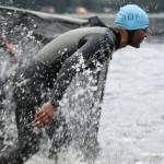 Ben Hohenstatt / Juneau Empire 
An athlete splashes their way into Auke Lake to start the swim leg of the Ironman Alaska in August 2022.