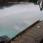 The privately owned 107-foot tugboat named Tagish sits submerged in the water next to the National Guard dock south of the downtown cruise ship docks Tuesday morning. (Clarise Larson / Juneau Empire)