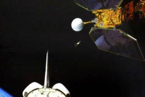 In this photo made available by NASA, the space shuttle Challenger launches the Earth Radiation Budget Satellite in 1984. On Friday, Jan. 6, 2023, the U.S. space agency said the 38-year-old NASA satellite is about to fall from the sky, but the chance of wreckage falling on anybody is “very low.” It's expected to come down Sunday night, give or take 17 hours. (NASA via AP)