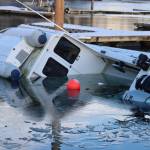 A boat sinks at Andrews Marina inside Fishermans Bend on Tuesday. (Jonson Kuhn / Juneau Empire)