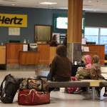 Clarise Larson / Juneau Empire 
Amy Nye and her family await a ride after flying to Juneau from Seattle Wednesday morning. Juneau International Airport Manager Patty Wahto said no flights in or out of Juneau have been delayed due to the overnight outage to the Federal Administration Aviation Notice to Air Missions System caused more than 8,300 delayed flights and 1,200 cancellations across the U.S.