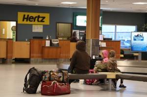 Clarise Larson / Juneau Empire 
Amy Nye and her family await a ride after flying to Juneau from Seattle Wednesday morning. Juneau International Airport Manager Patty Wahto said no flights in or out of Juneau have been delayed due to the overnight outage to the Federal Administration Aviation Notice to Air Missions System caused more than 8,300 delayed flights and 1,200 cancellations across the U.S.