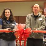 Safeway grocery manager Michelle Lecorchick and inventory control manager Adam Tolles cut the red ribbon during Wednesdays grand reopening ceremony for the stores Juneau location. (Jonson Kuhn / Juneau Empire)